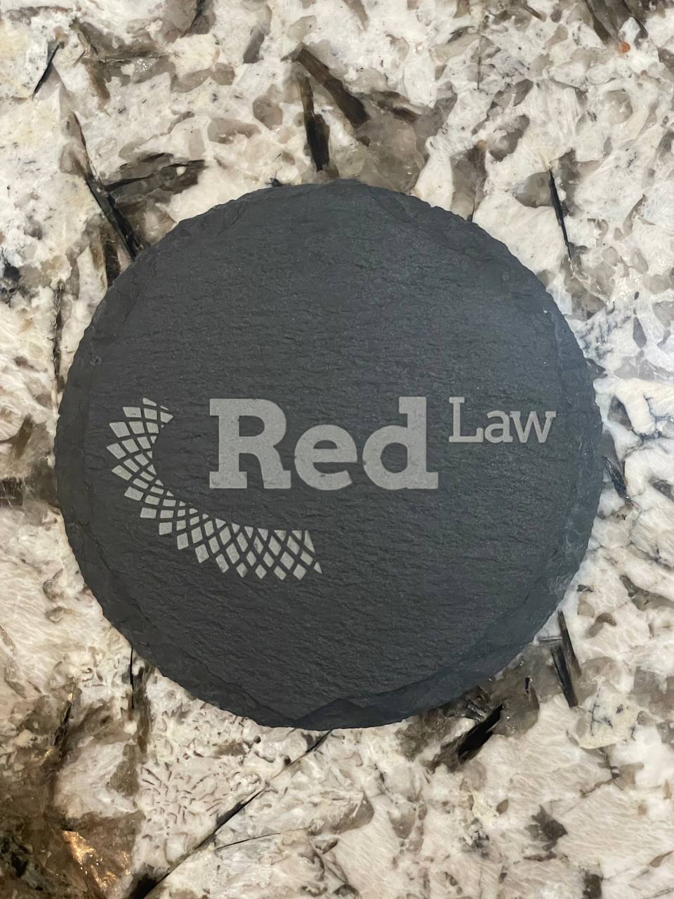 Engraved slate coaster with a corporate logo